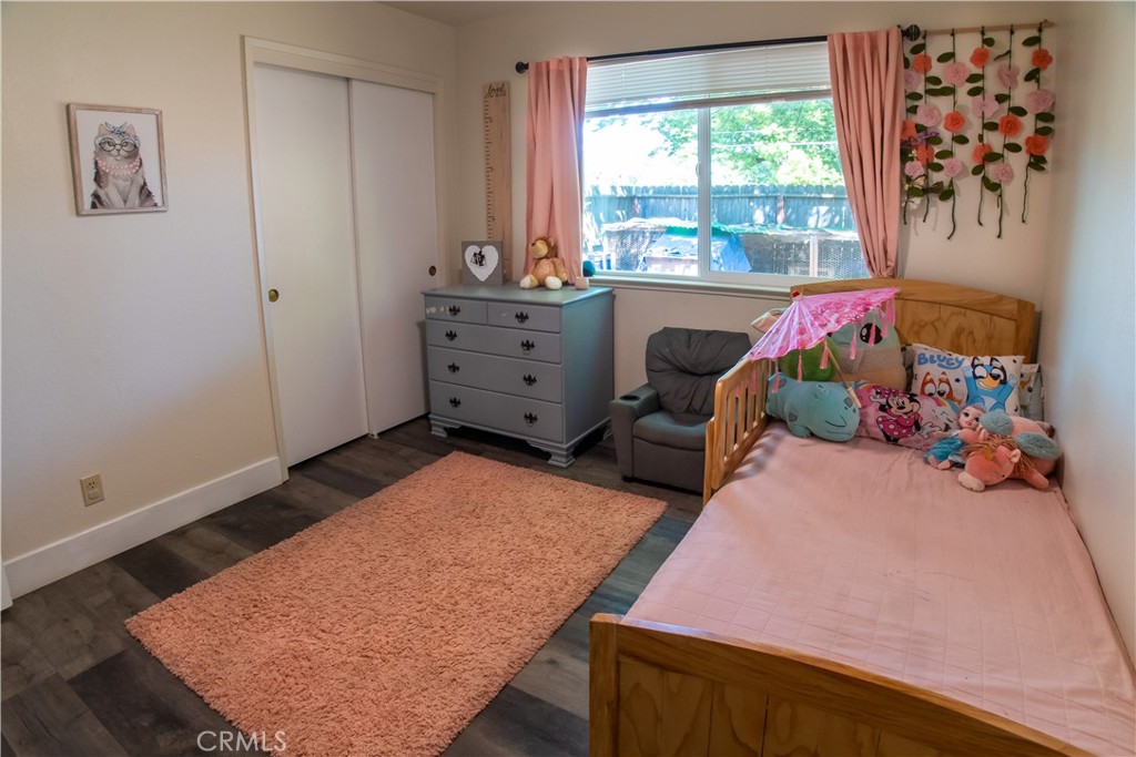 1 San Ramon Drive Chico, CA 95973 - Photo 19 of 42 a bed room with furniture and a window