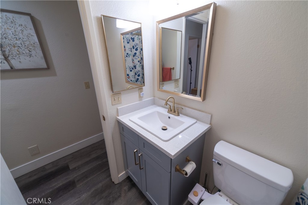 1 San Ramon Drive Chico, CA 95973 - Photo 22 of 42 a bathroom with a sink toilet and mirror