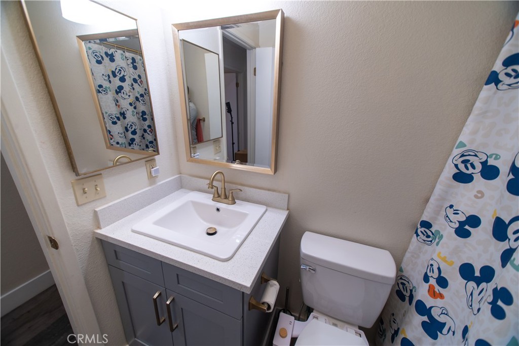 1 San Ramon Drive Chico, CA 95973 - Photo 23 of 42 a bathroom with a sink and a mirror