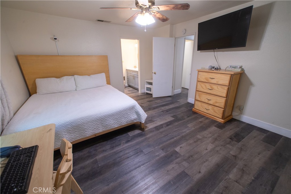 1 San Ramon Drive Chico, CA 95973 - Photo 25 of 42 a bedroom with a bed and a flat screen tv