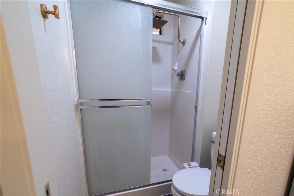1 San Ramon Drive Chico, CA 95973 - Photo 28 of 42 a white toilet sitting next to a shower