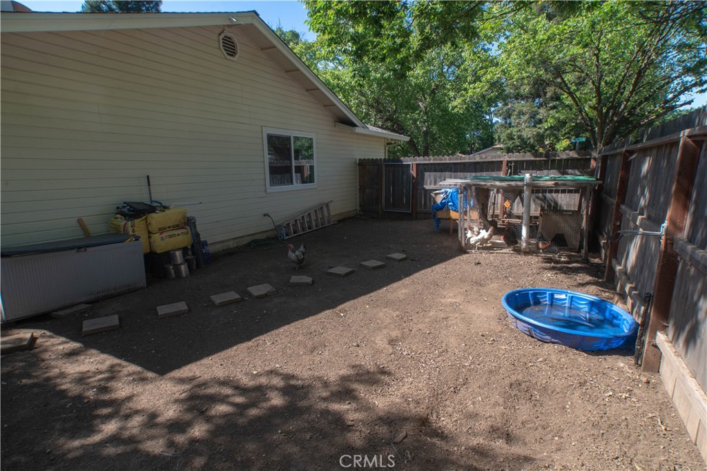 1 San Ramon Drive Chico, CA 95973 - Photo 36 of 42 a backyard of a house with table and chairs