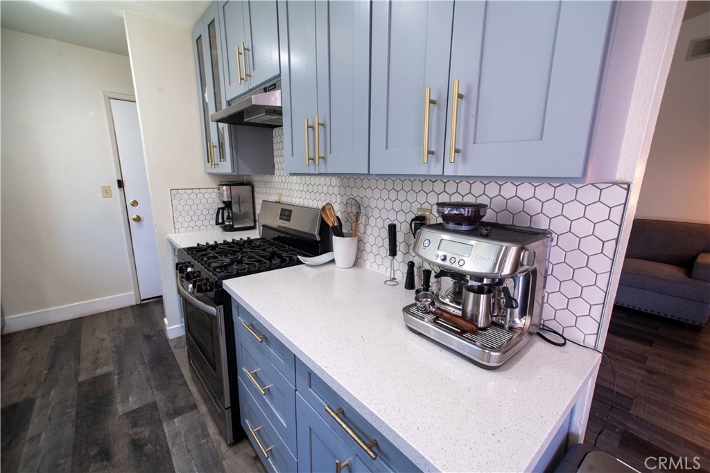 1 San Ramon Drive Chico, CA 95973 - Photo 10 of 42 a kitchen with a stove and a white cabinets