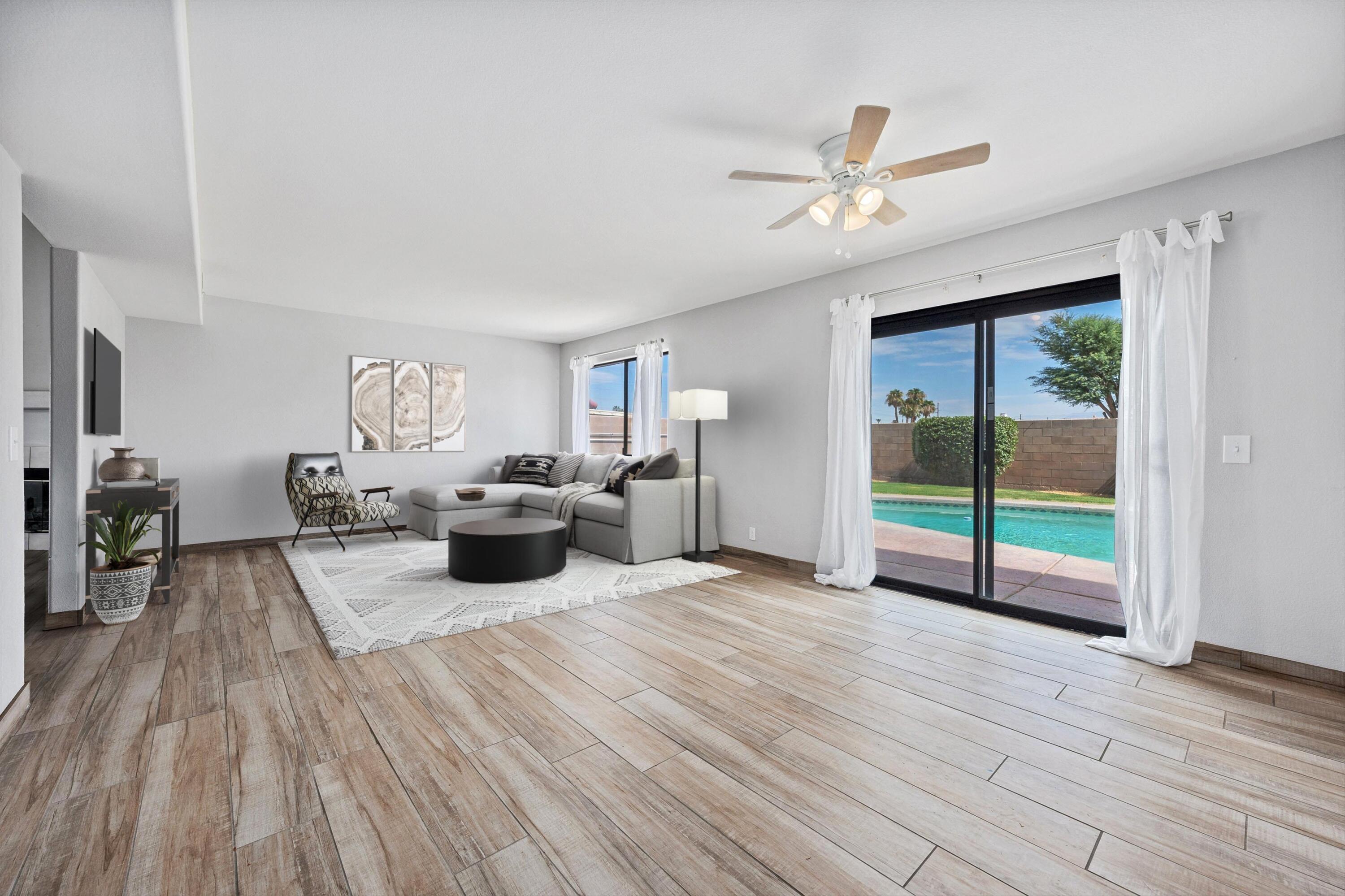 81064 Jessica Way Indio, CA 92201 - Photo 12 of 34 a living room with furniture and a large window