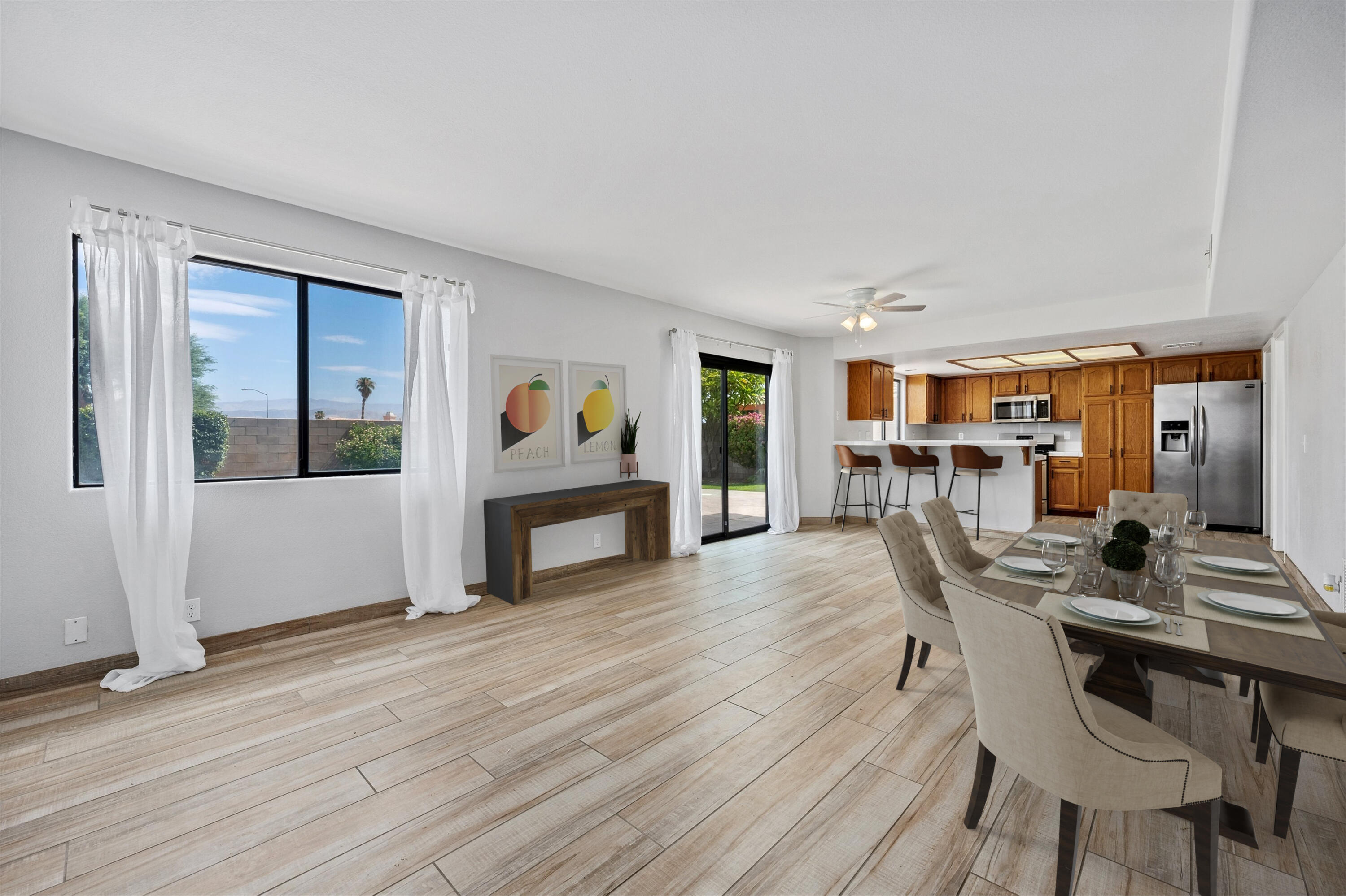 81064 Jessica Way Indio, CA 92201 - Photo 14 of 34 a dining room with furniture and wooden floor
