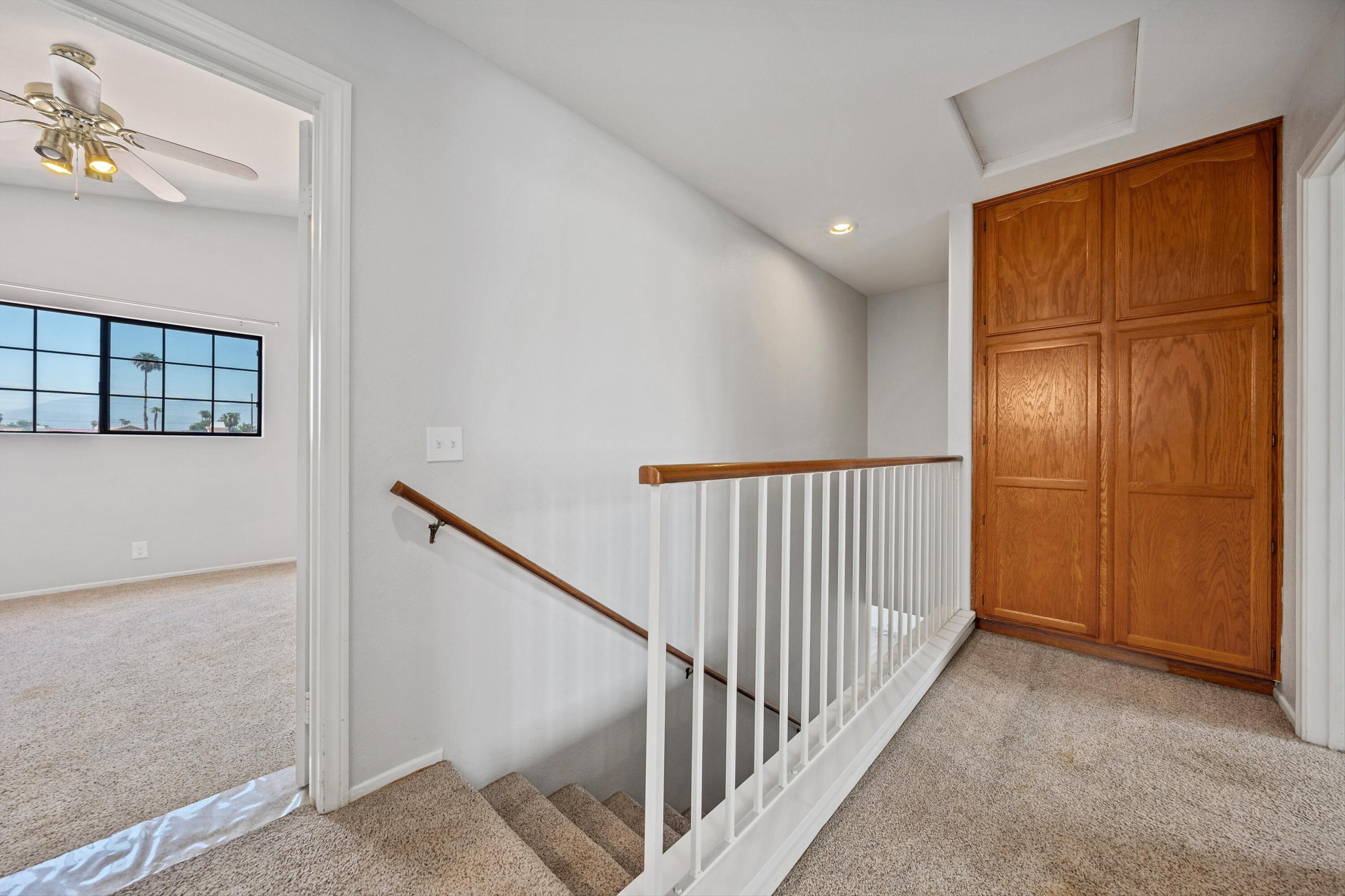 81064 Jessica Way Indio, CA 92201 - Photo 25 of 34 a view of a hallway with wooden floor and entryway