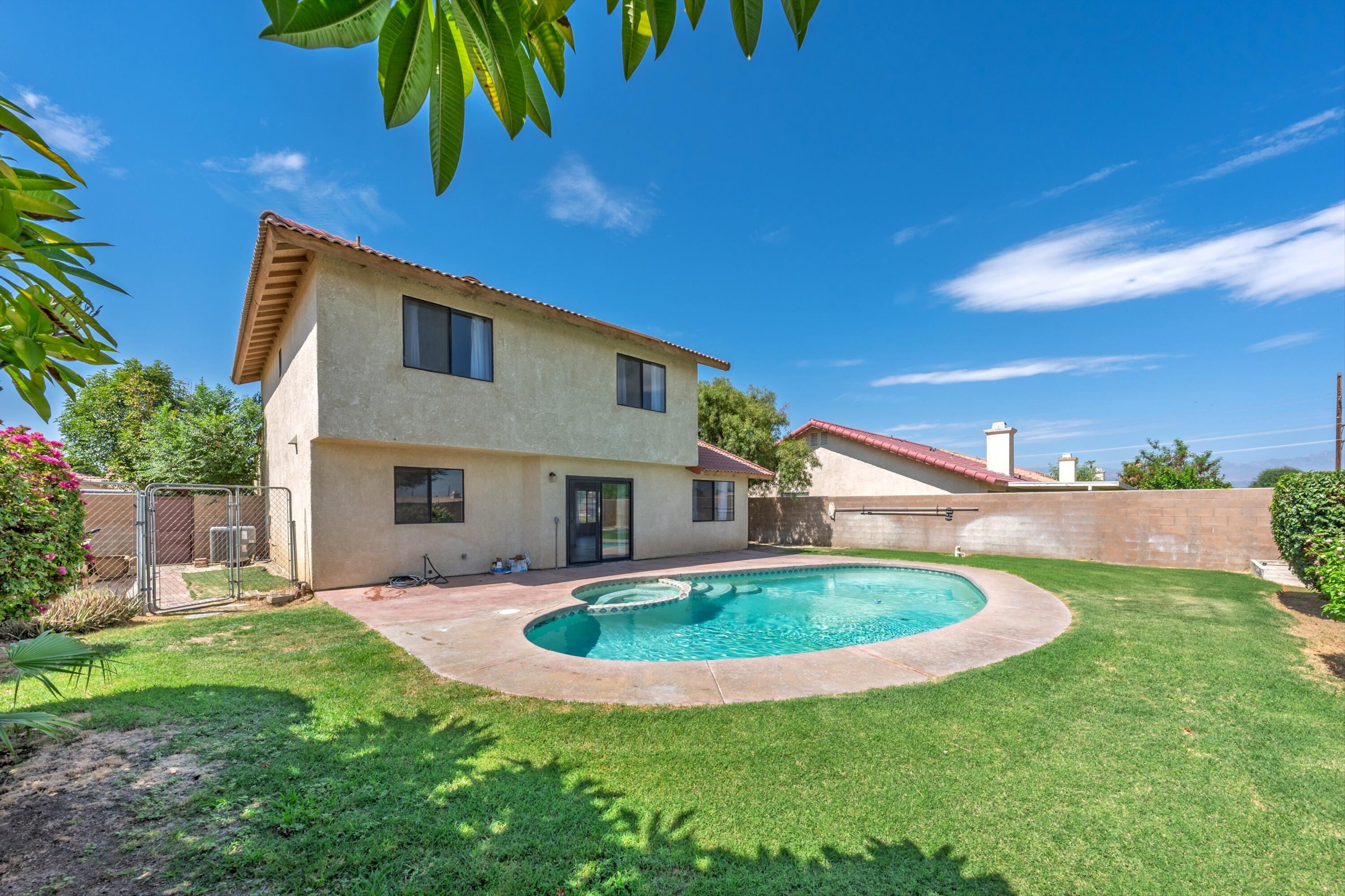 81064 Jessica Way Indio, CA 92201 - Photo 4 of 34 a view of outdoor space yard and swimming pool