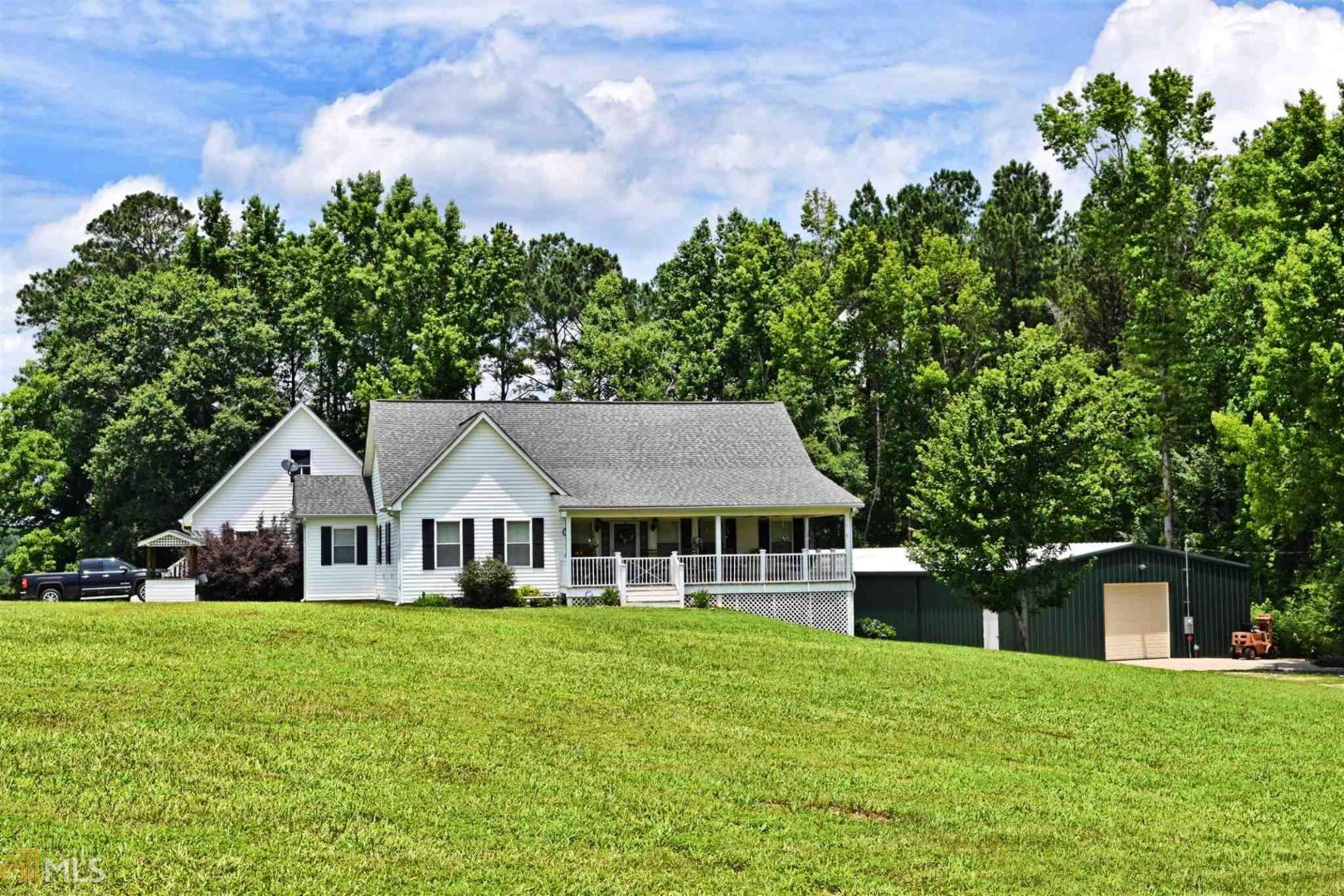 179 Hoyt Road Milner, GA 30257 - Photo 1 of 1 a front view of a house with a yard