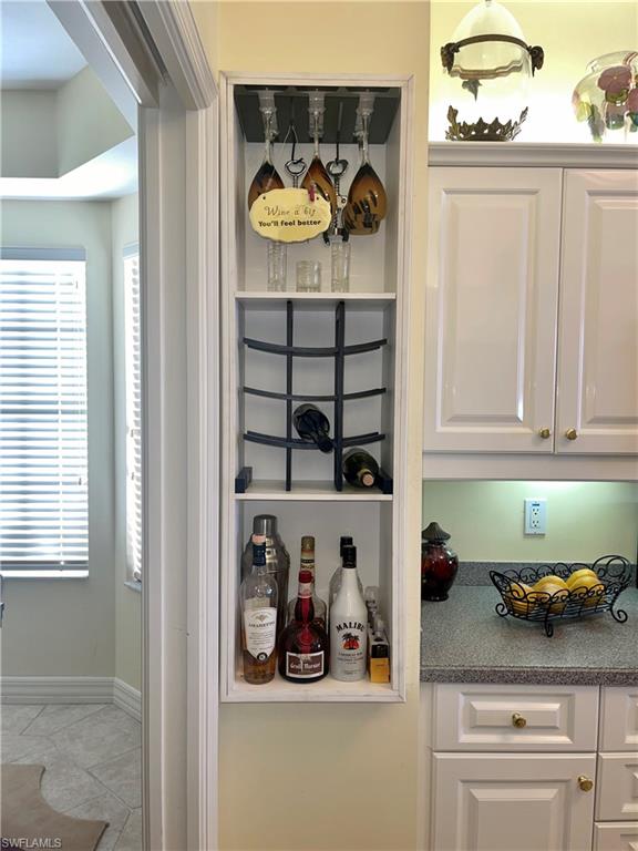 451 Bayfront Place, Unit 5311 Naples, FL 34102 - Photo 19 of 38 a kitchen with a refrigerator and cabinets
