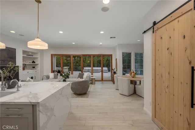 a large room with lots of counter space and windows