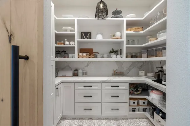 a view of cabinets with a book shelf