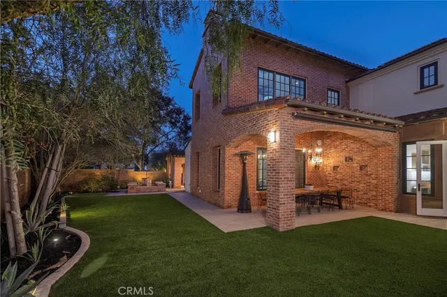 a view of a house with a yard porch and sitting area