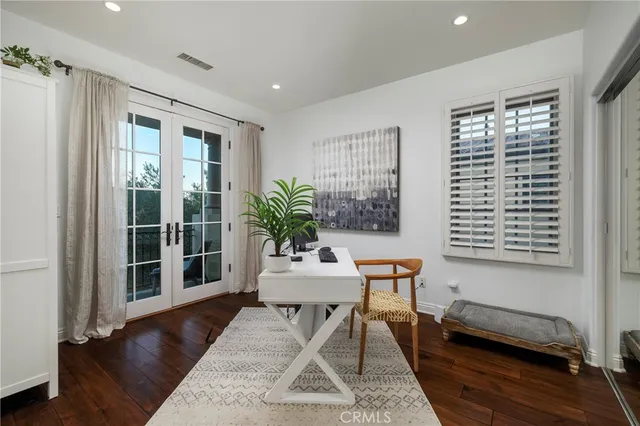 a work room with furniture and a window
