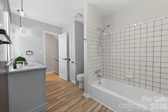 a bathroom with a bathtub and sink