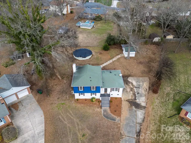 an aerial view of a house with outdoor space