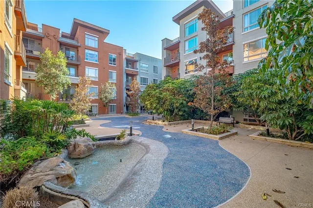 a view of a swimming pool with outdoor seating
