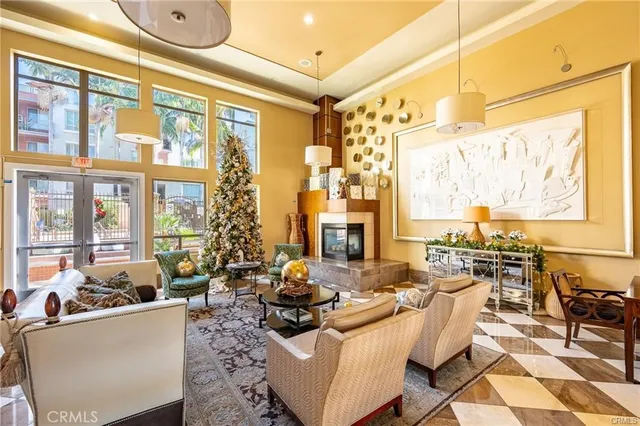 a view of a building with a yard and sitting area