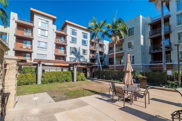 a swimming pool with outdoor seating and yard