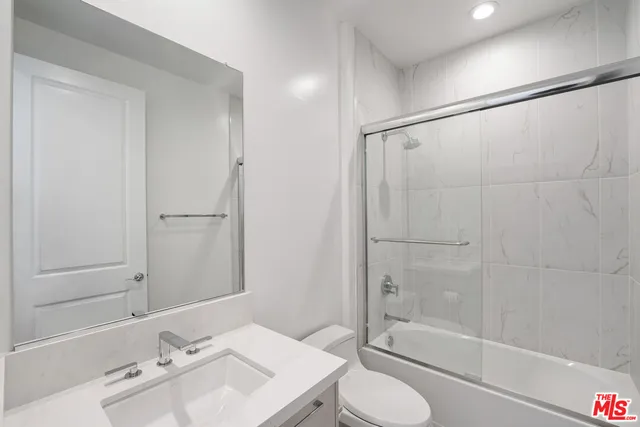 a living room with couch and a table