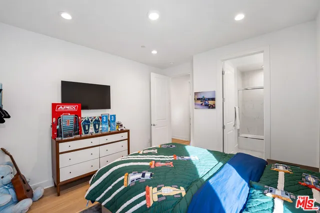 a kitchen with a large window and cabinets