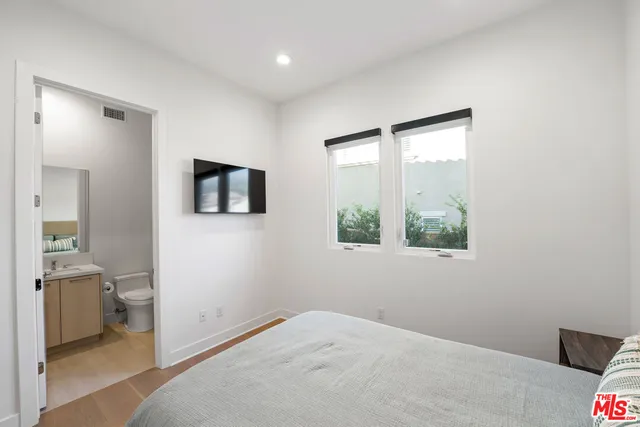 a view of a swimming pool and outdoor seating