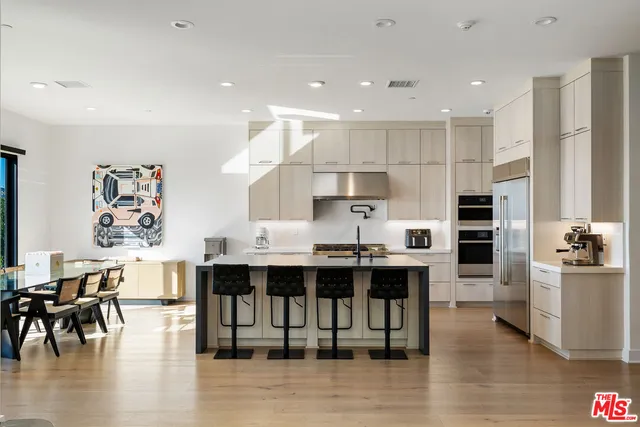 a view of a room with furniture and window