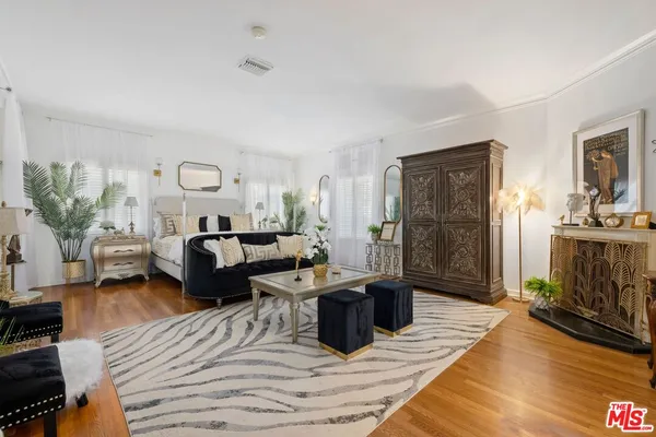 a living room with furniture and a rug