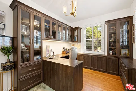 a bedroom with a bed a couch and dresser