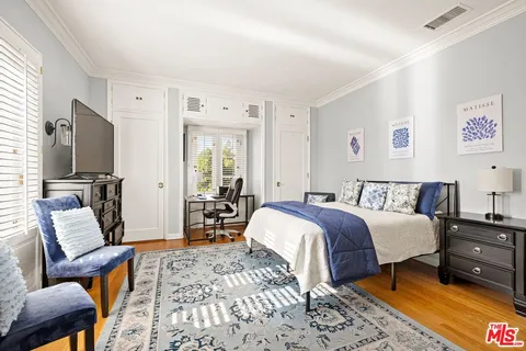 a room with pool table and glass windows