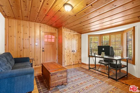 a front view of a house with garden and patio