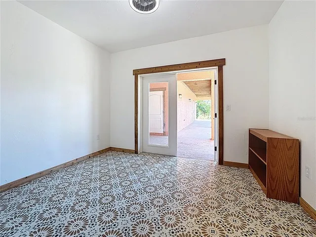 a view of a patio with couches and potted plants
