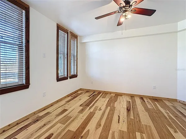 a view of an empty room with a fireplace