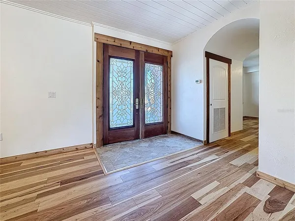 a view of balcony with wooden floor