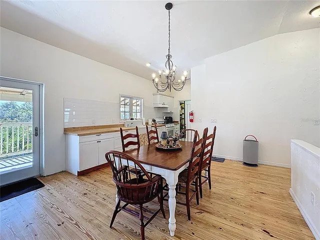 a front view of a house with plants