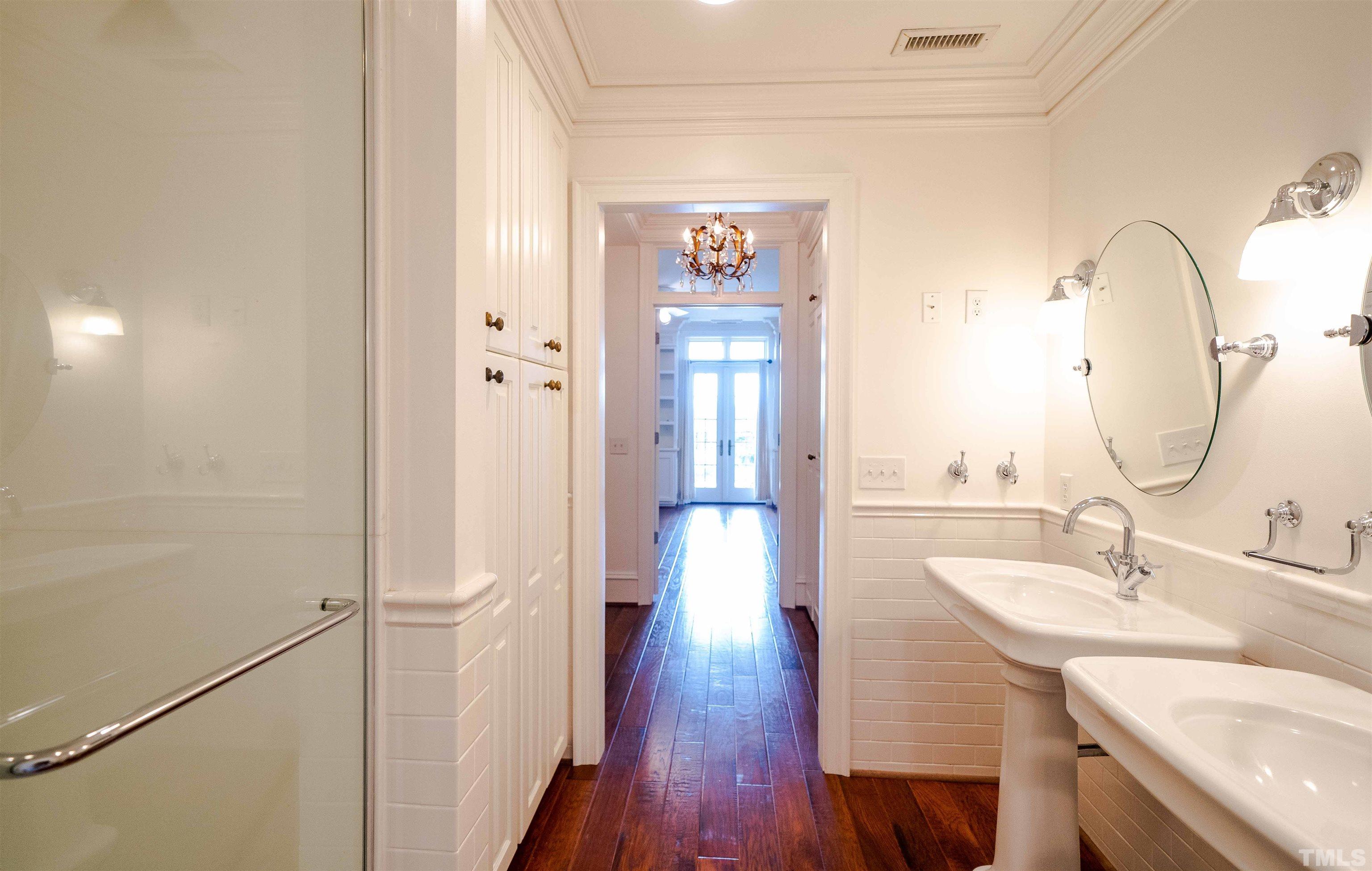 710 Independence Place, Unit 407 Raleigh, NC 27603 - Photo 7 of 10 a bathroom with a sink and a mirror