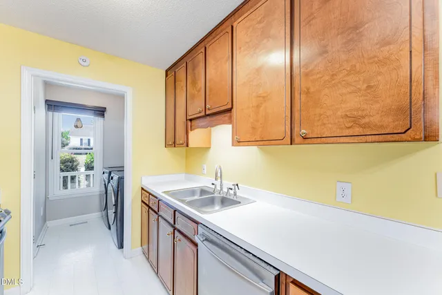 a kitchen with table and chairs