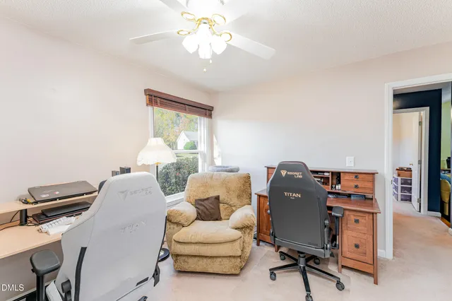 a view of a wooden balcony next to a yard