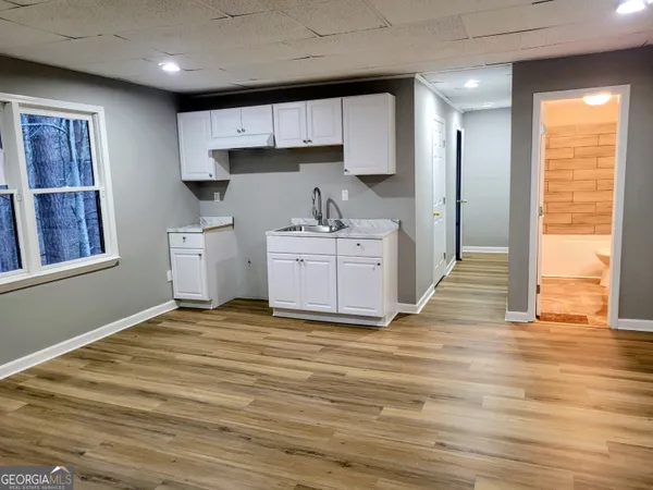 a kitchen with stainless steel appliances granite countertop a stove a refrigerator and a sink