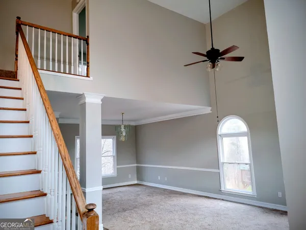 a view of an entryway with wooden floor