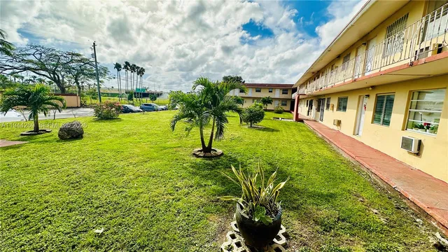 a view of yard with swimming pool