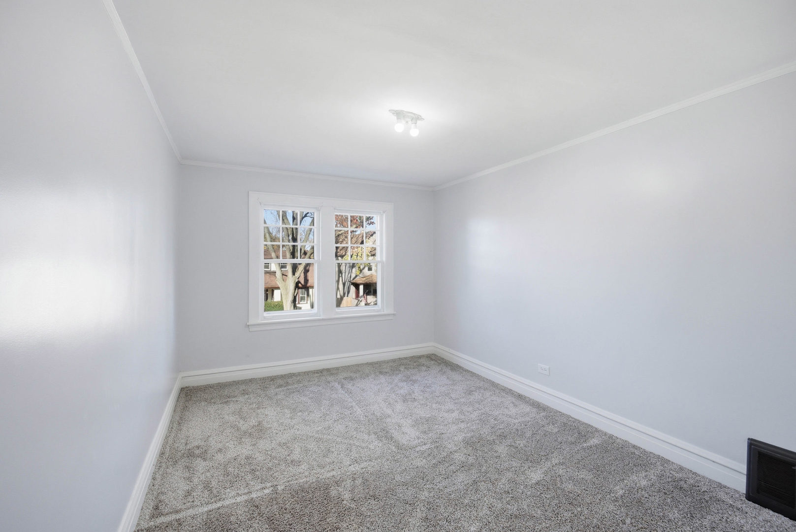 1489 East Algonquin Road Des Plaines, IL 60016 - Photo 14 of 34 an empty room with a window