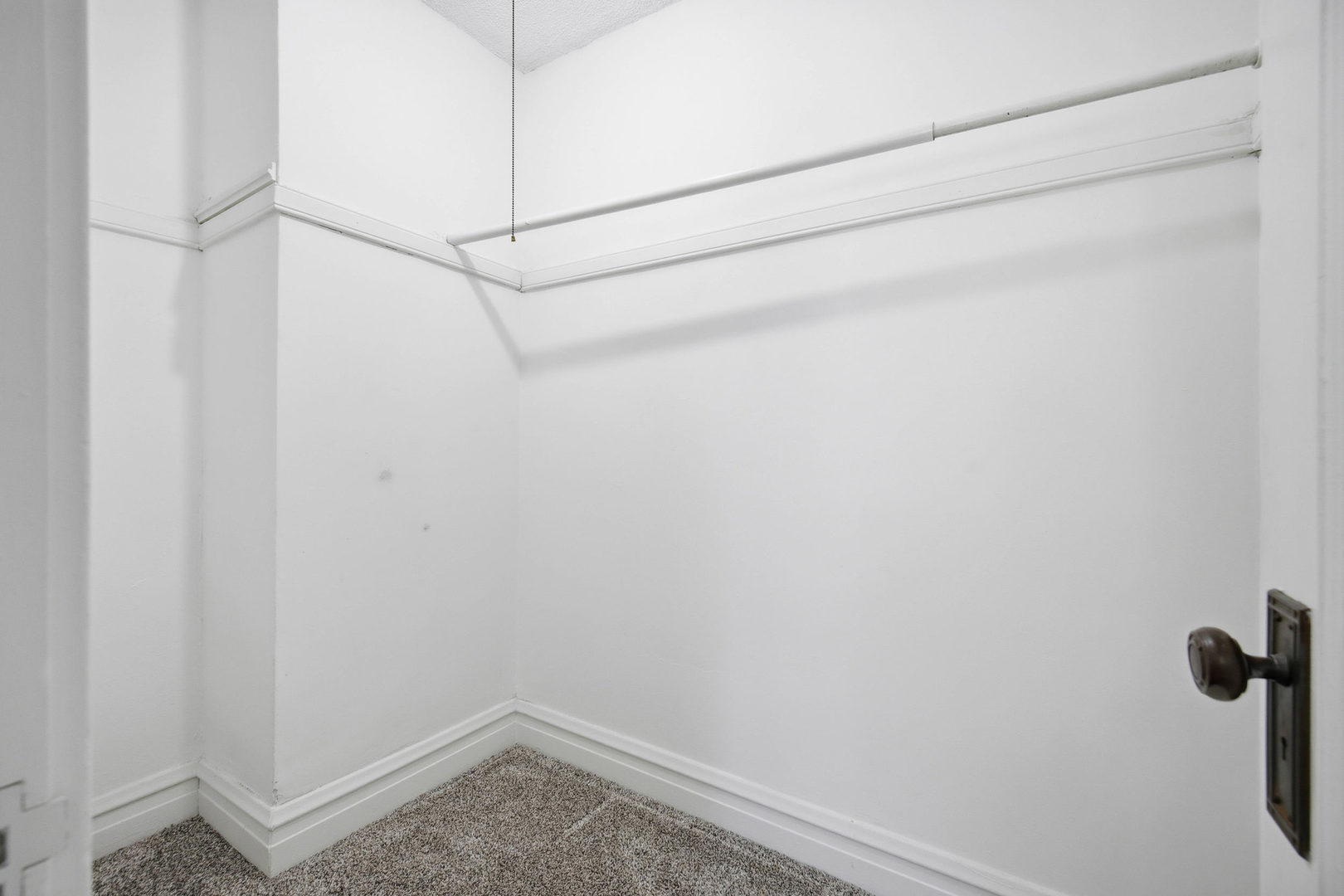 1489 East Algonquin Road Des Plaines, IL 60016 - Photo 17 of 34 a view of a room with racks on the wall