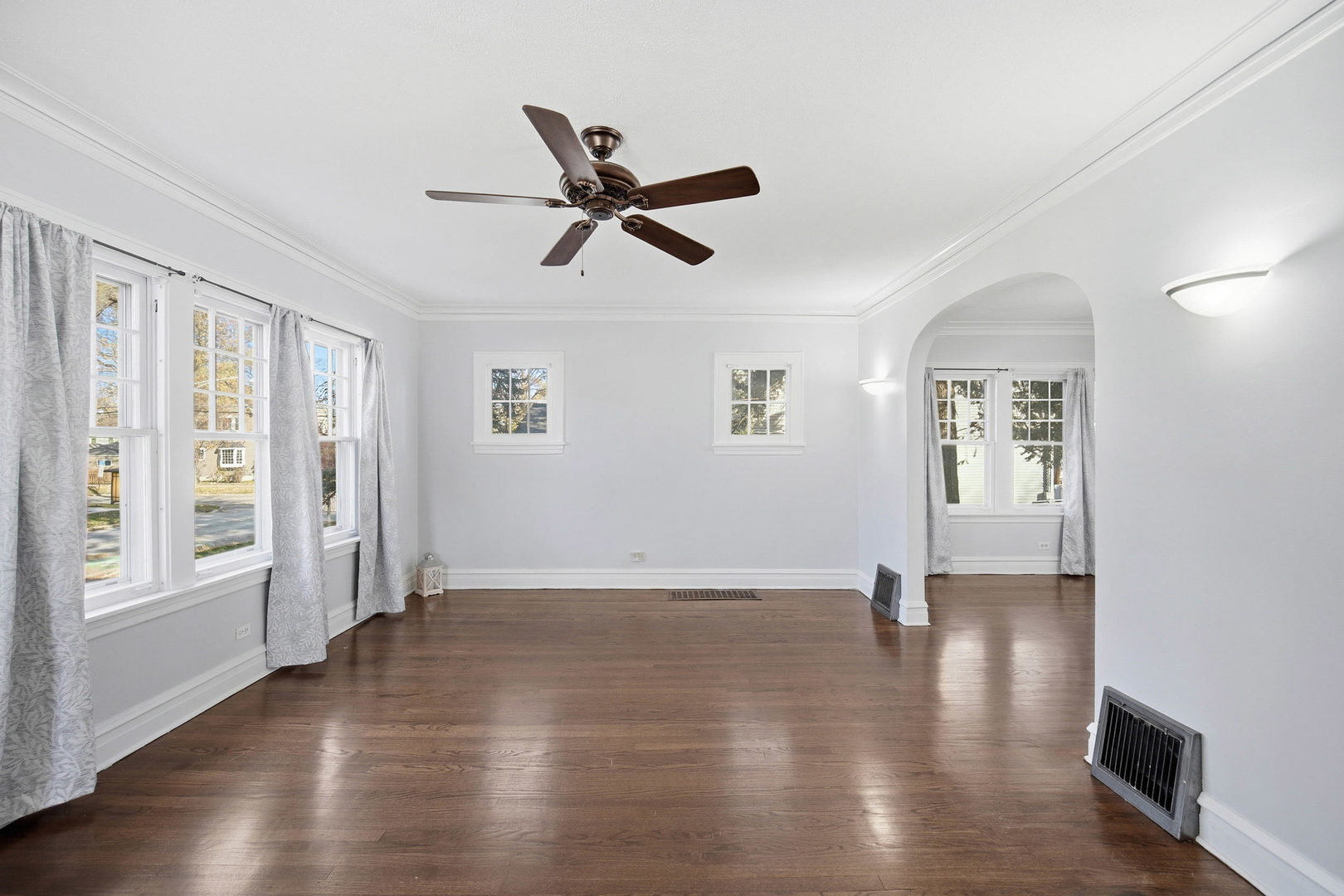 1489 East Algonquin Road Des Plaines, IL 60016 - Photo 5 of 34 a view of empty room with wooden floor and window