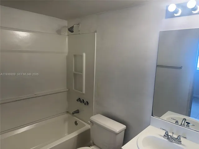 a view of a swimming pool with a lounge chairs