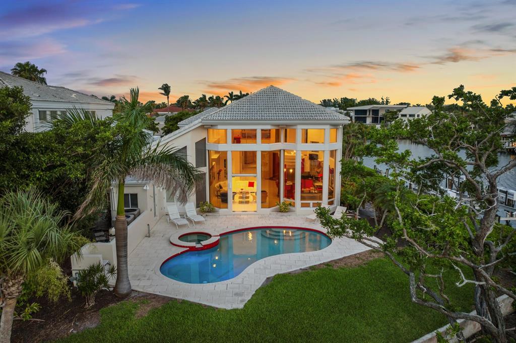 3576 Fair Oaks Way Longboat Key, FL 34228 - Photo 1 of 1 a front view of a house with a yard
