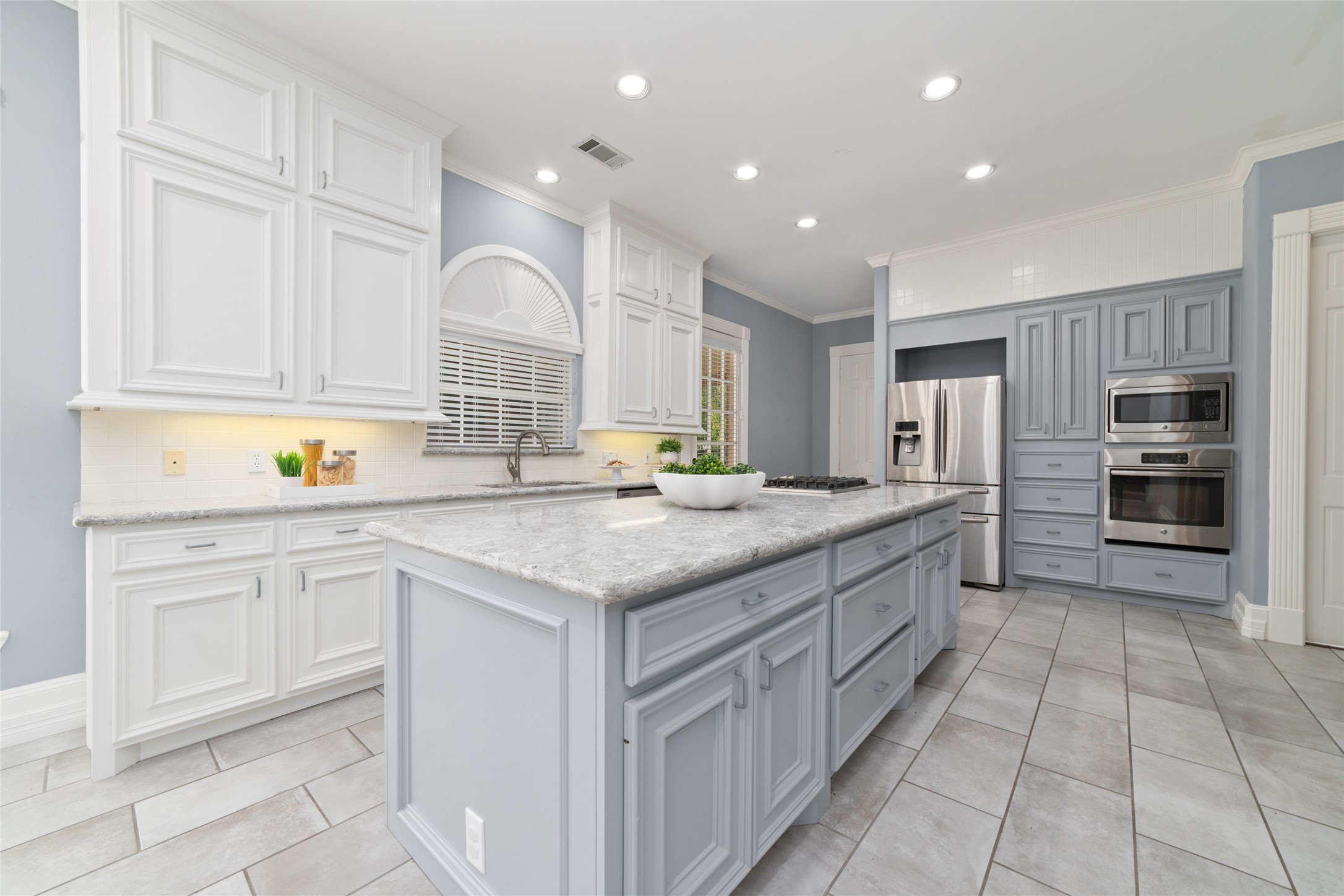16114 Lafone Drive Spring, TX 77379 - Photo 8 of 45 Designed for both everyday living and easy entertaining, this beautiful kitchen offers an oversized island, abundant cabinetry, expansive countertop workspace and stainless steel appliances.