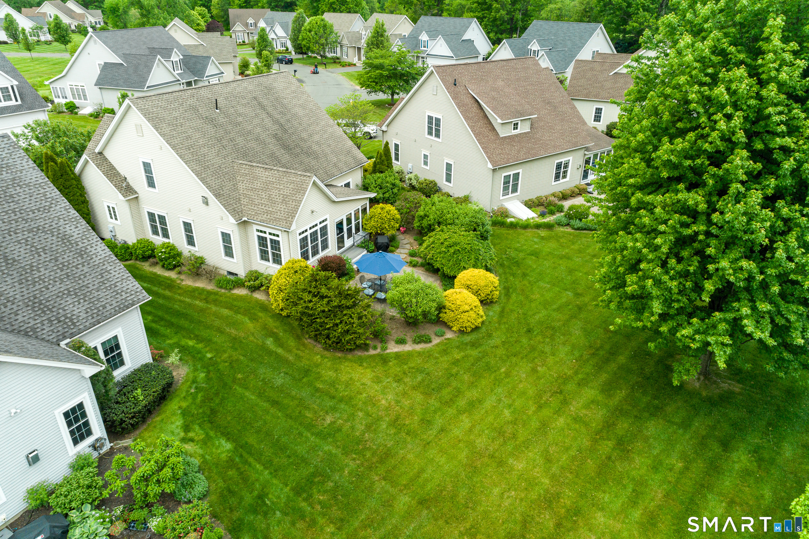 8 Greendale Drive, Unit 8 Suffield, CT 06078 - Photo 36 of 40 an aerial view of multiple houses with yard
