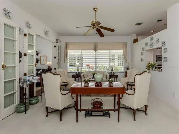 a dining room with furniture and window