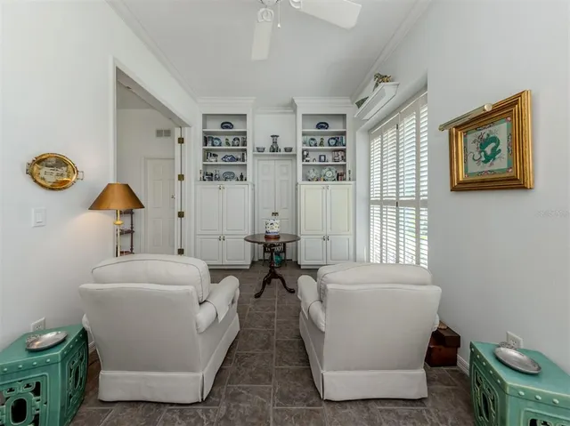 a view of swimming pool with outdoor seating and a patio