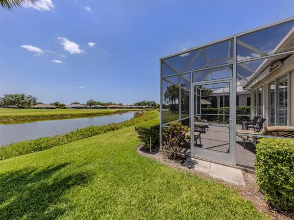 a kitchen with stainless steel appliances kitchen island granite countertop a refrigerator and a stove top oven